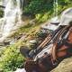 Shallow focus photography of backpack on top of boulder